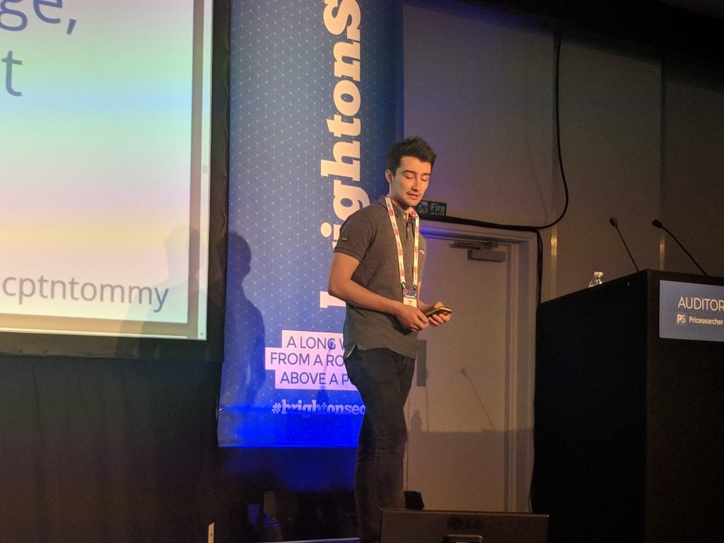 Tom Pool on stage at Brighton SEO